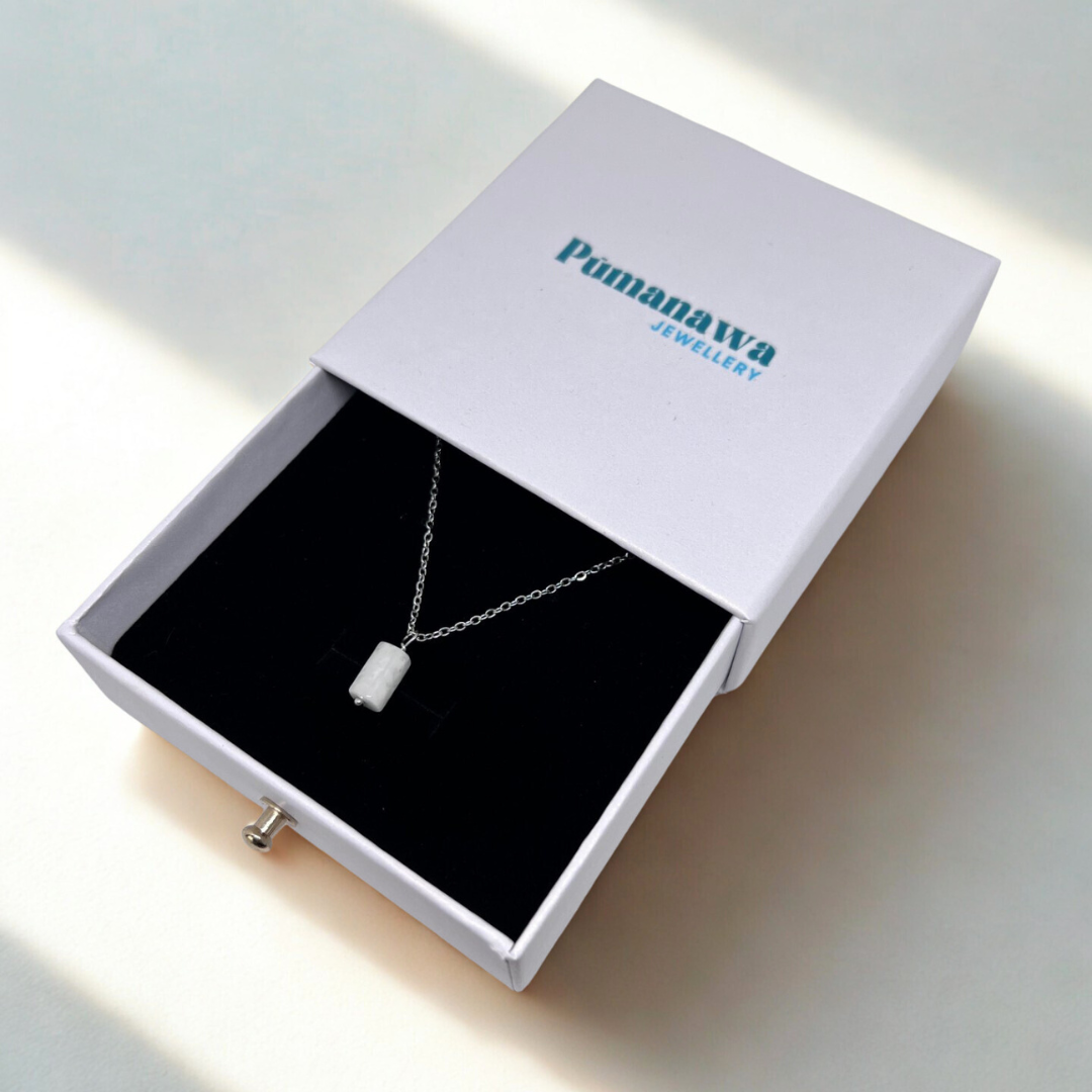 Necklace in a Pumanawa Jewellery box on a light surface