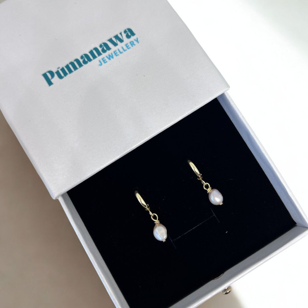 Pearl earrings in a Pumanawa Jewellery box on a light background